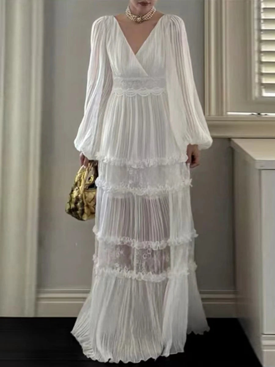 Woman wearing a white lace dress in an indoor setting