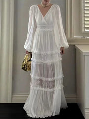 Woman wearing a white lace dress in an indoor setting