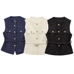 Three vests in blue, white, and black on a white background