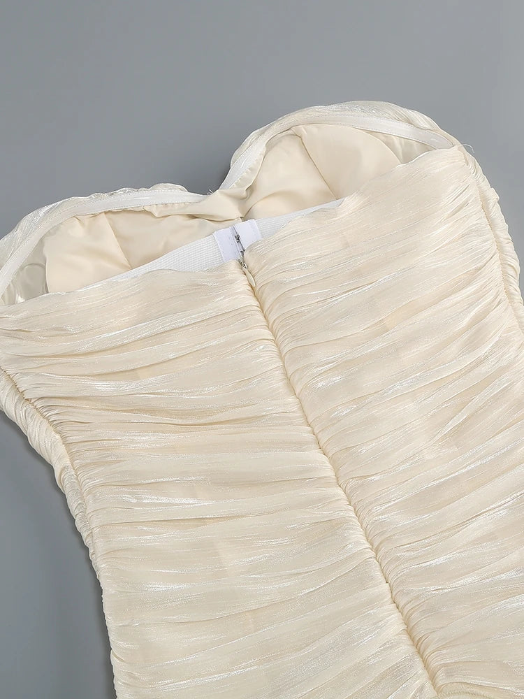 Close-up of a textured beige fabric garment on a gray background