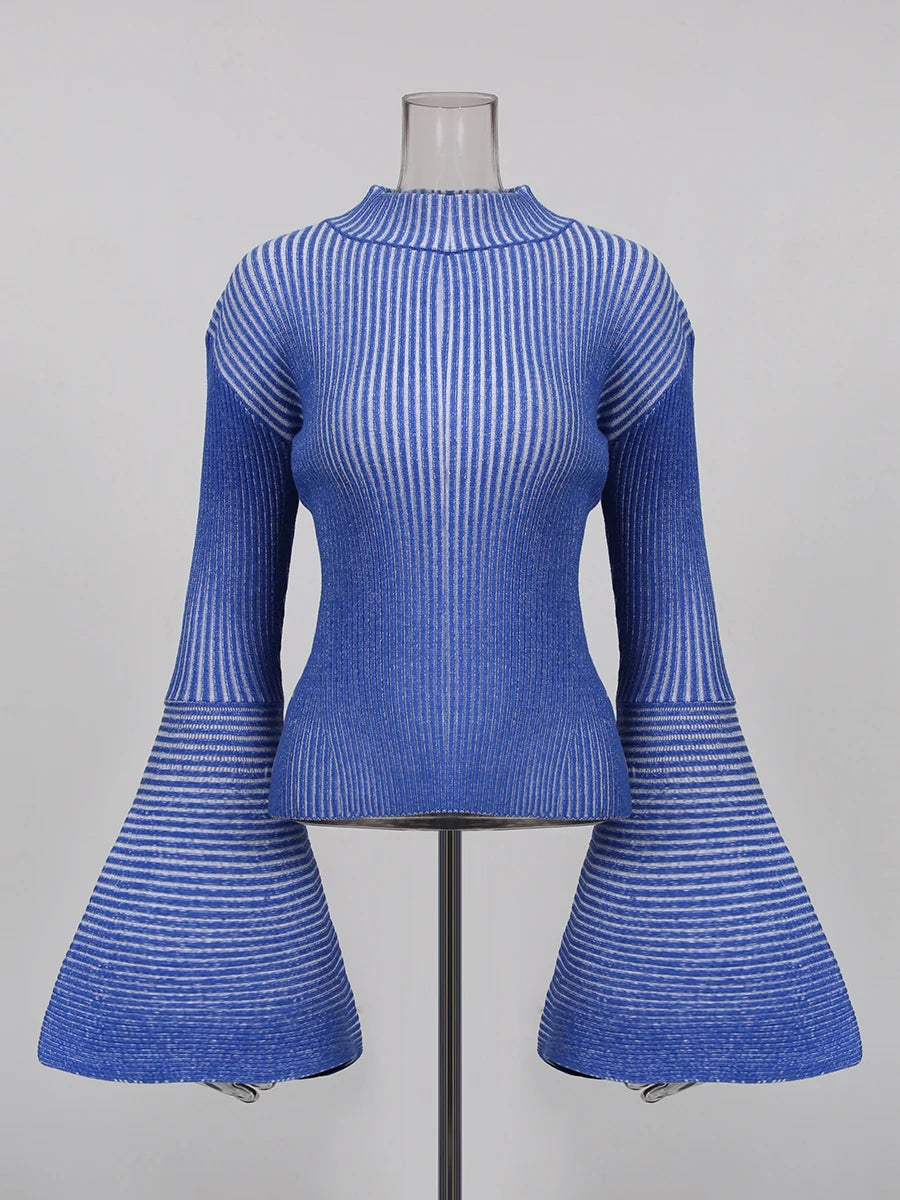 Blue ribbed top with flared sleeves on a mannequin against a grey background