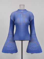 Blue ribbed top with flared sleeves on a mannequin against a grey background