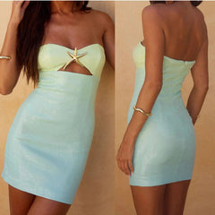 Two views of a strapless dress with a starfish detail on a beige background