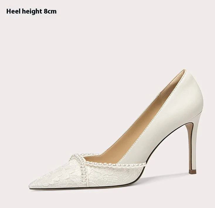 White high-heeled shoe on a light pink background with text indicating heel height.