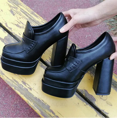 Close-up of chunky platform block heel loafers