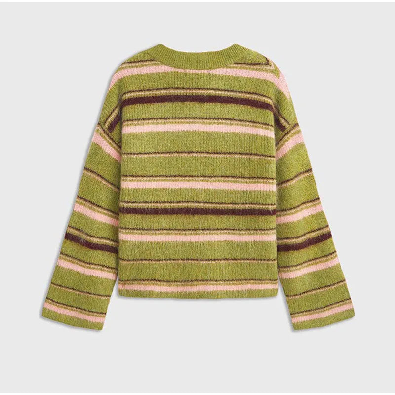 Green, pink, and brown striped sweater on a light gray background