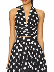 Vintage-inspired polka dot co-ord set shown in a mid-calf silhouette.