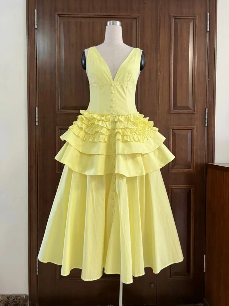 Yellow dress on a mannequin against a wooden door background