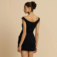 Woman wearing a black dress with a beige background