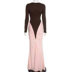 Mannequin wearing a dress with a brown top and pink skirt on a white background