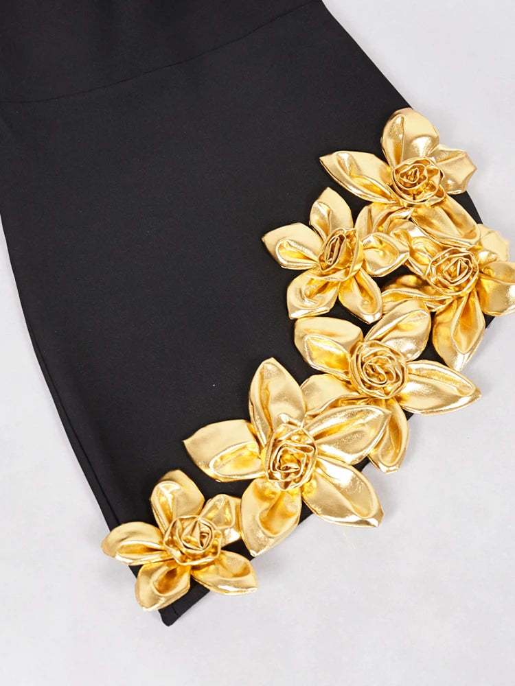 Black skirt with gold floral embellishments on a white background