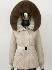 Beige quilted jacket with a large brown fur hood on a mannequin against a white background