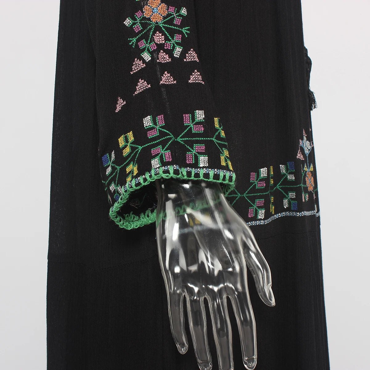 Black garment with colorful floral embroidery