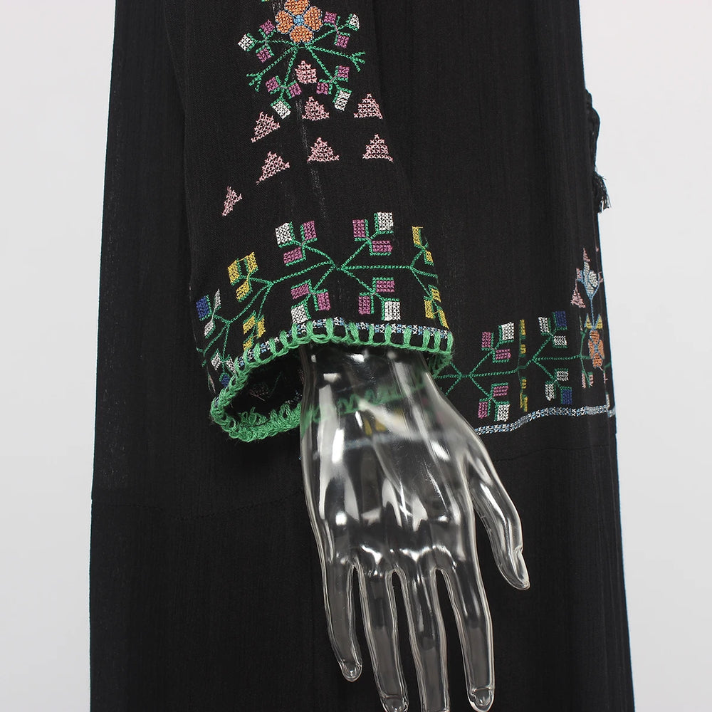 Black garment with colorful floral embroidery