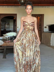 Woman wearing a strapless, patterned dress in an indoor setting