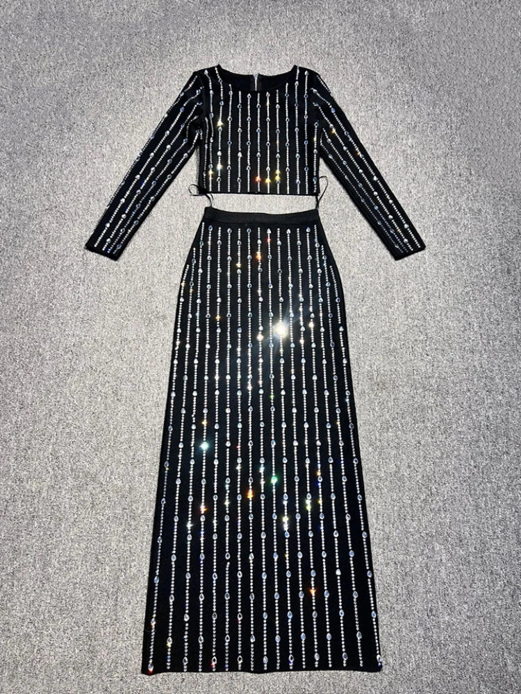 Black outfit with sparkling details on a gray background