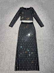 Black outfit with sparkling details on a gray background