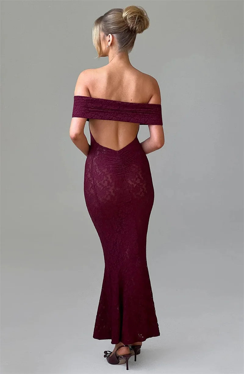 Burgundy off-shoulder lace evening gown on a plain background