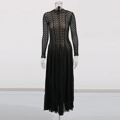 Black lace dress on a mannequin against a white background