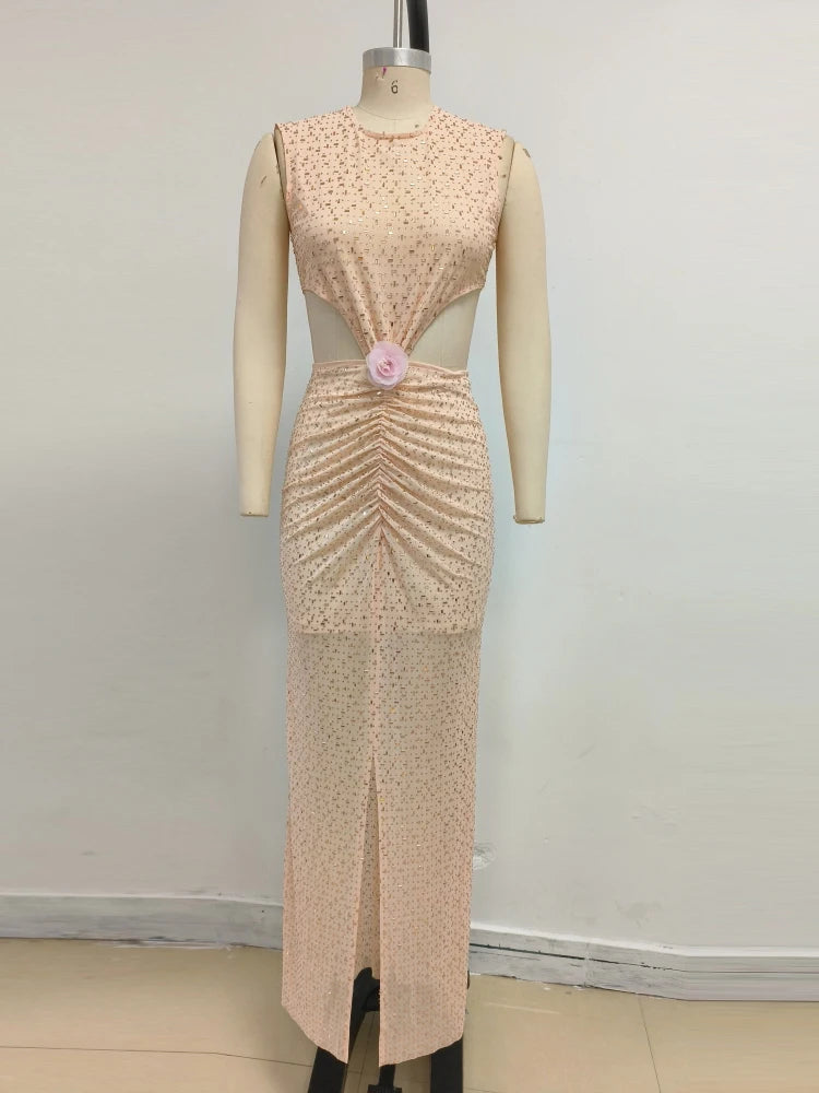 Apricot evening gown on a mannequin against a white background
