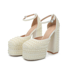 White pearl platform high heels on a white background
