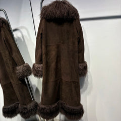 Brown coat with fur trim on a rack