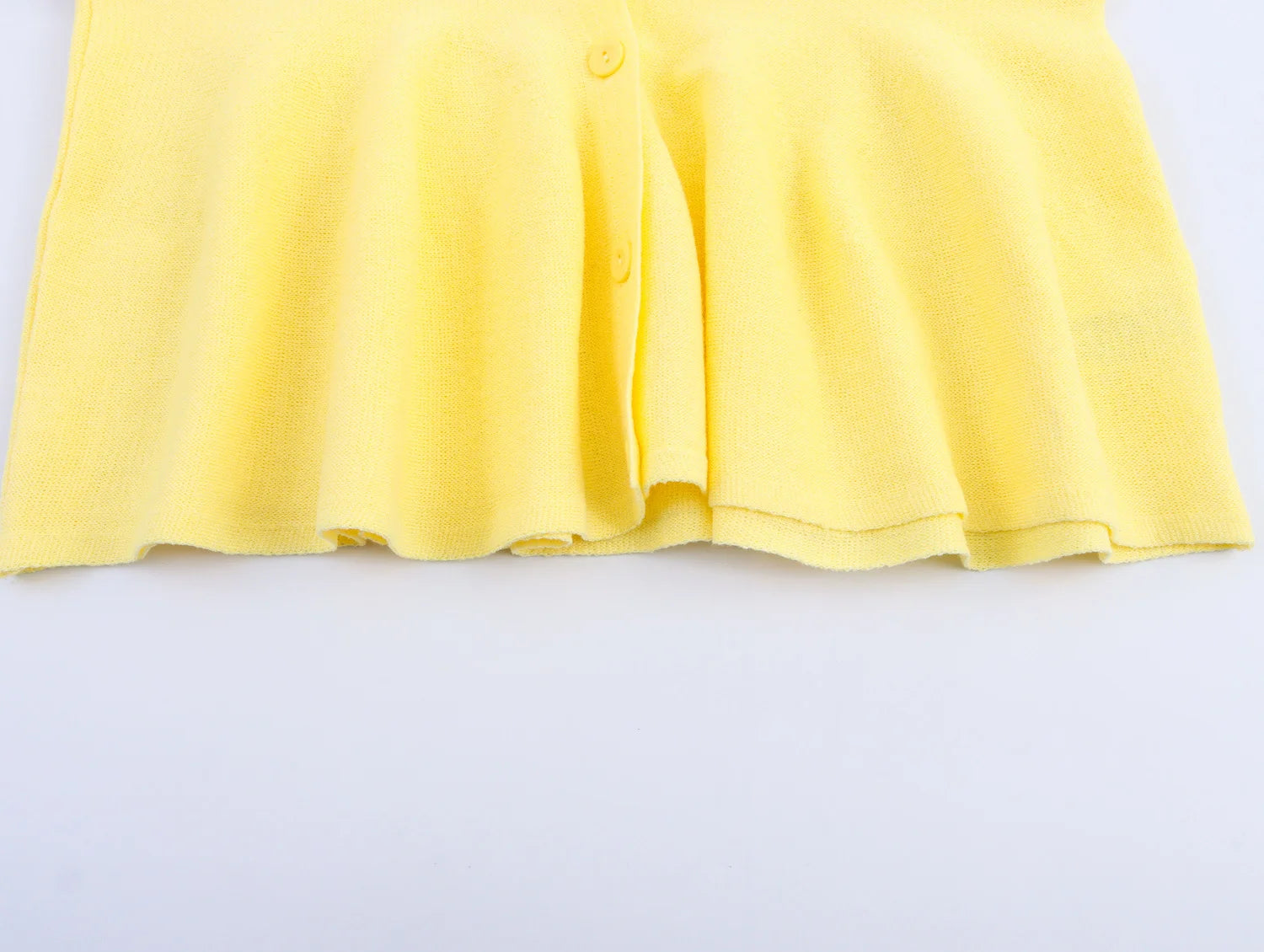 Yellow dress on a light gray background