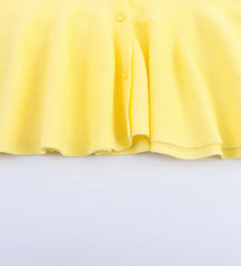 Yellow dress on a light gray background