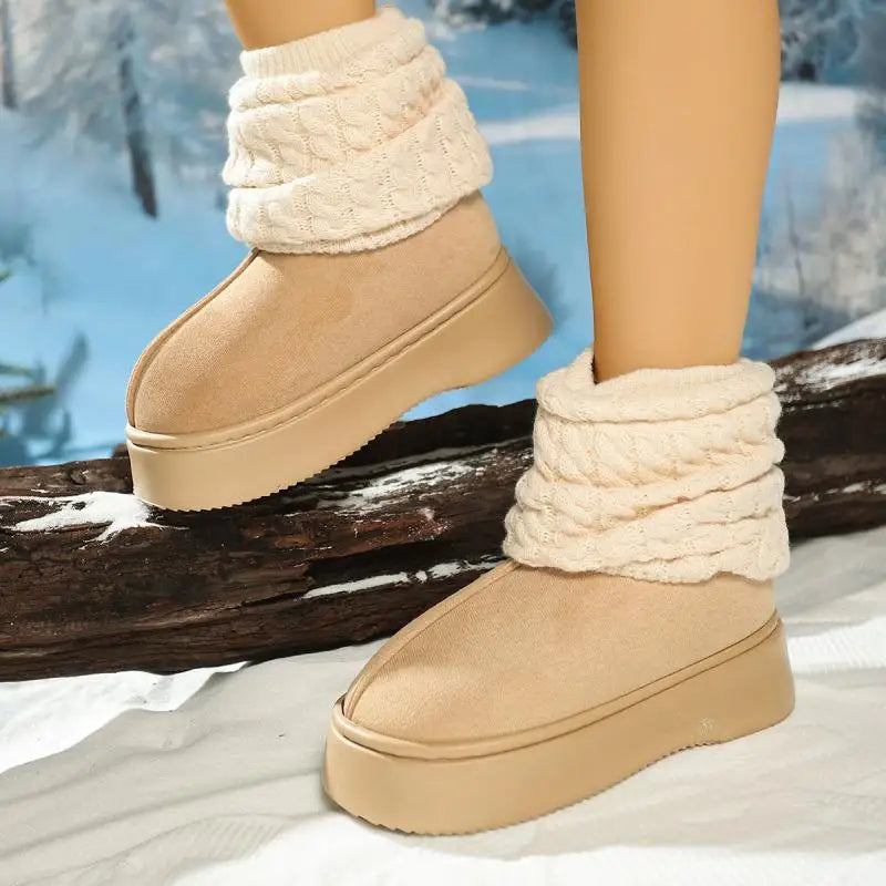 Beige winter boots with white cuffs worn in a snowy landscape