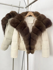 White puffer jacket with brown fur trim on a hanger against a white background