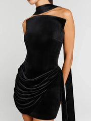Close-up detail of the draped velvet mini dress