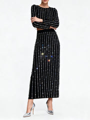 Black outfit with sequin details on a white background