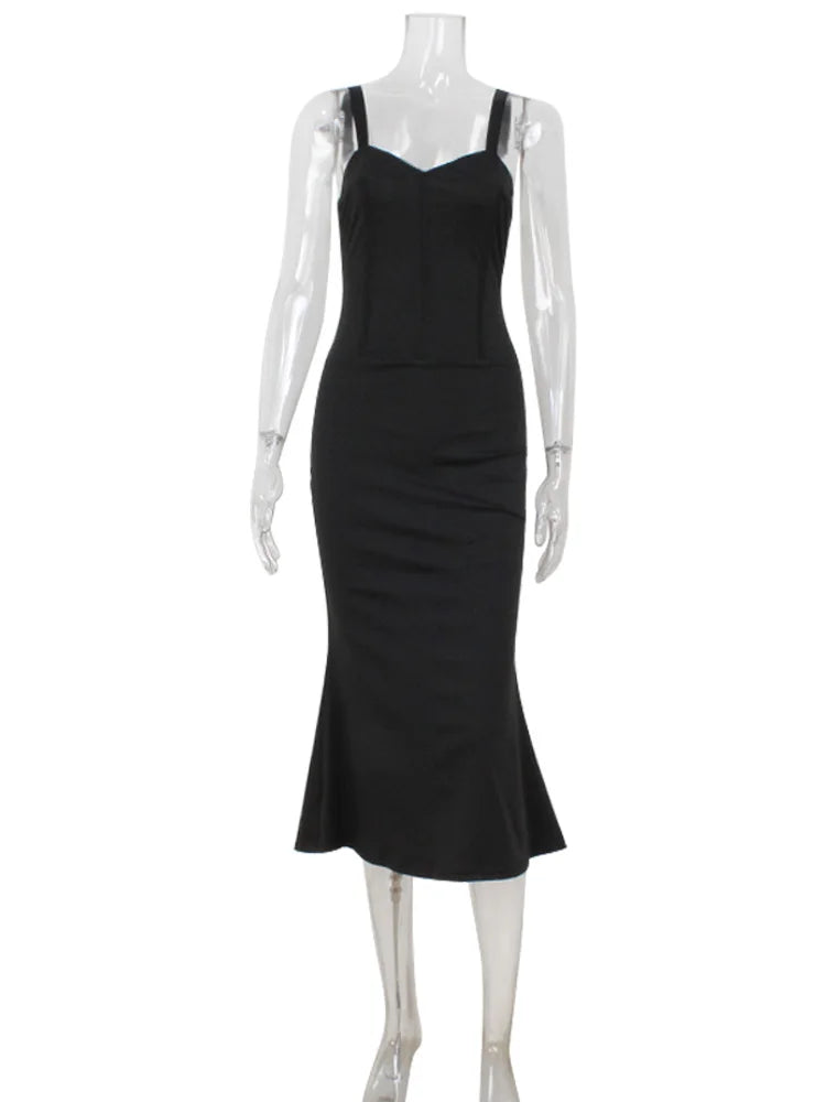 Black dress on a mannequin against a white background