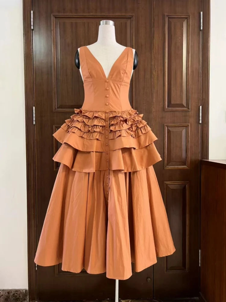 Orange dress on a mannequin against a wooden door background