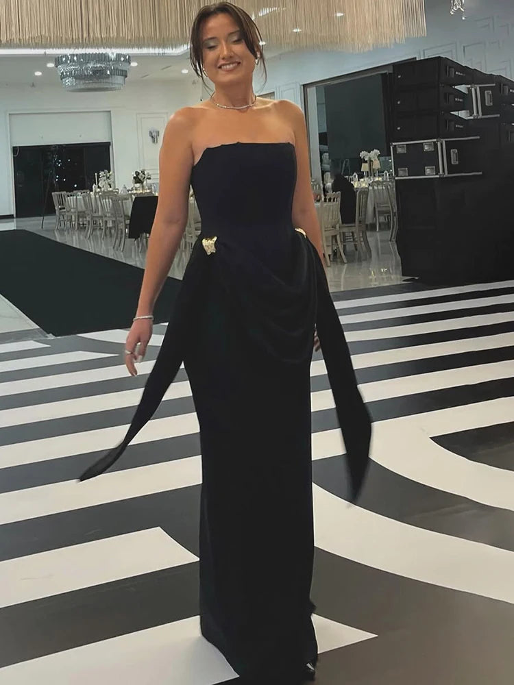 Black strapless draped maxi dress with long sash details