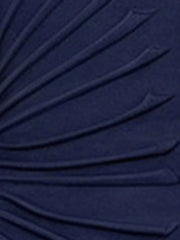 Close-up of the asymmetrical ruched fabric detail on a navy dress