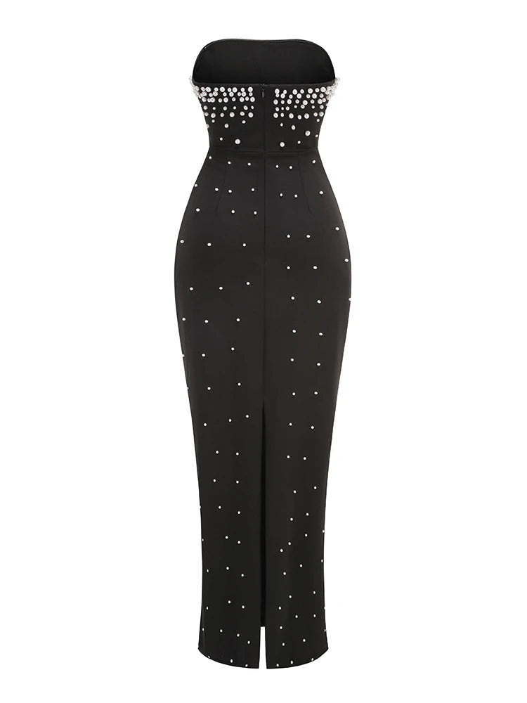 Black strapless jumpsuit with silver bead embellishments on a white background