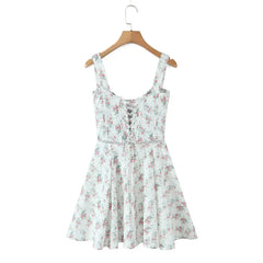 Floral dress on a hanger against a white background