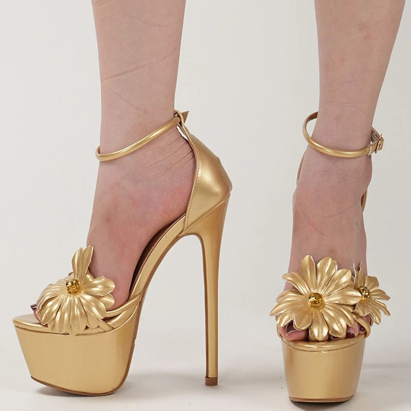 Gold high-heeled shoes with floral designs