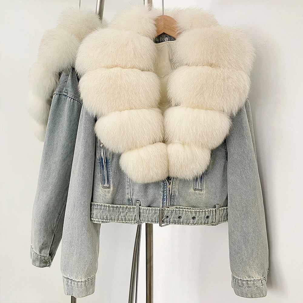 Denim jacket with white fur trim on a mannequin against a white background