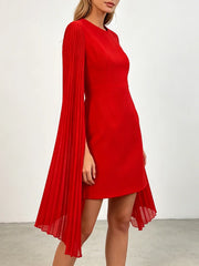 Red mini dress from side with pleated cape sleeves