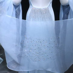 Light blue dress with sparkling embellishments on a mannequin