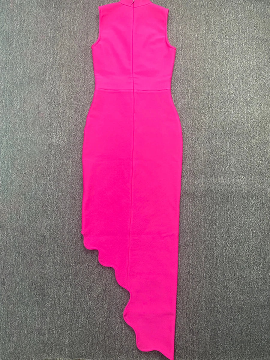 Pink dress with a unique cutout design on a gray surface