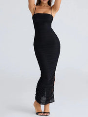 Black ruched dress worn by a model