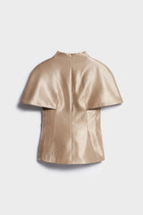 Gold leather cape on a light gray background