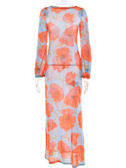 Floral patterned dress with orange flowers on a light blue background