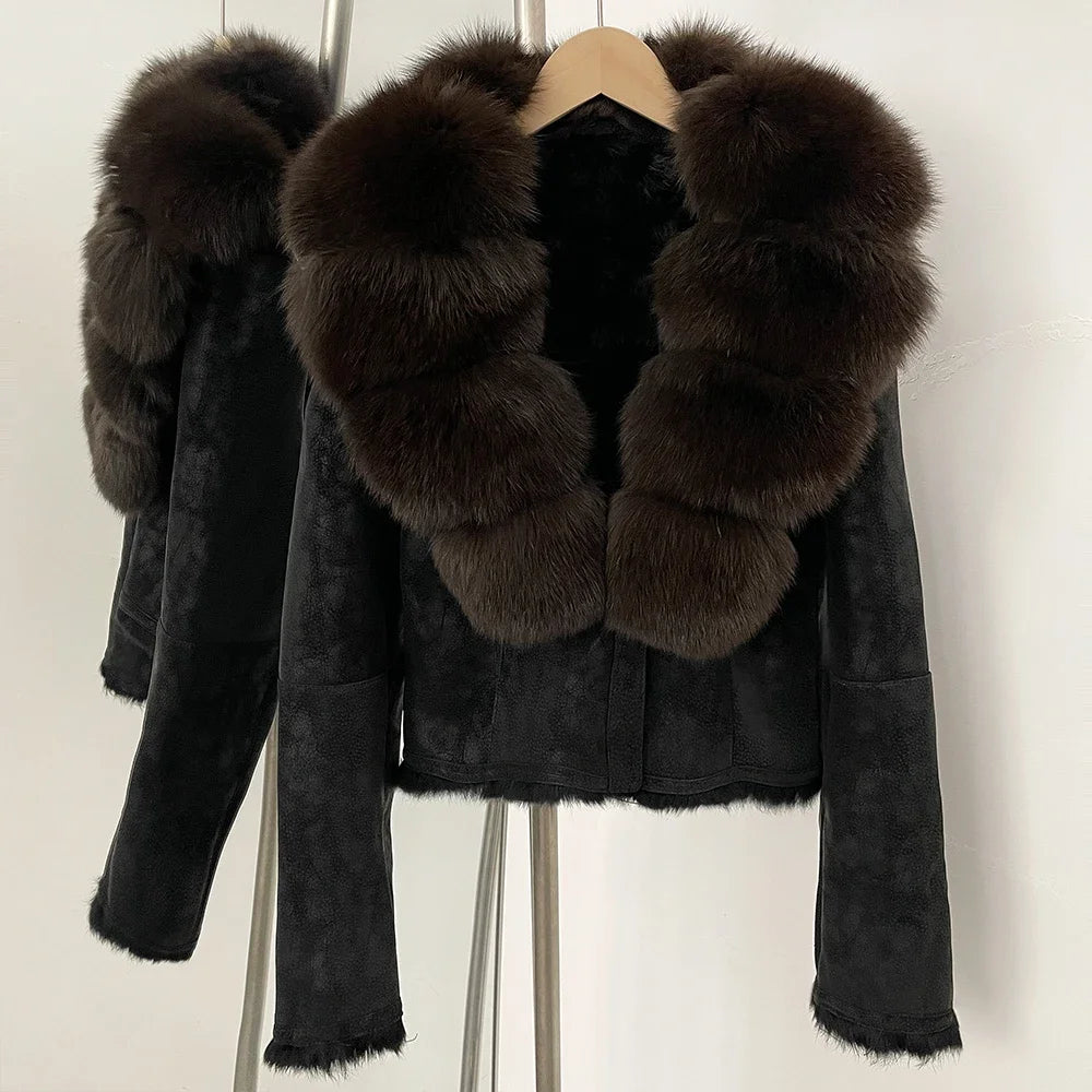 Black jacket with brown fur collar on a hanger against a white background