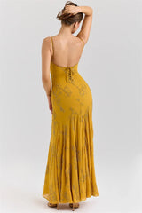 Yellow floral dress with open back on a white background