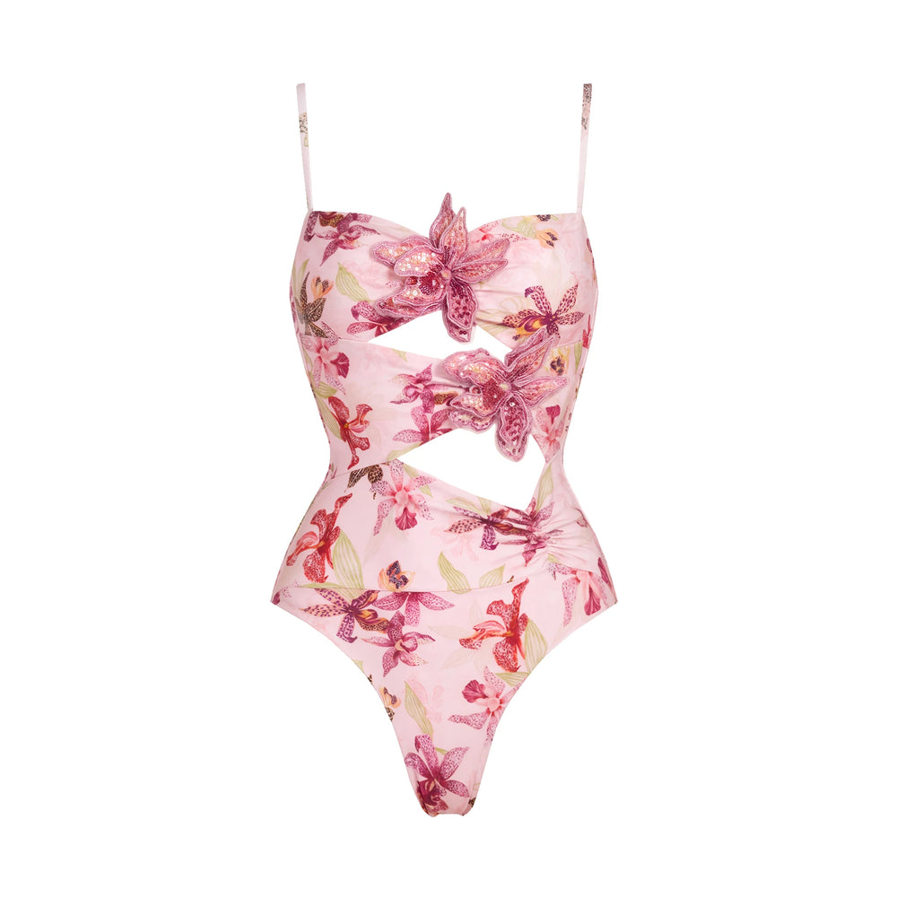 Pink floral print one-piece swimsuit with cut-outs and embellished flowers.
