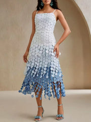 Woman wearing a blue and white dress with a gradient effect on a beige background